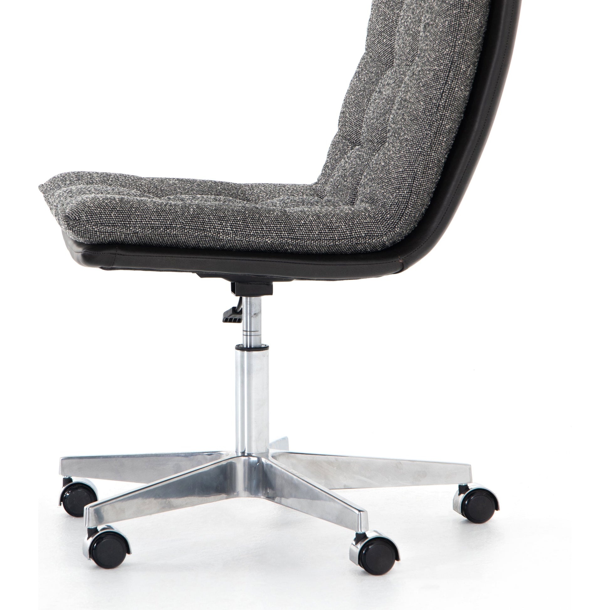 Quinn Desk Chair by Four Hands in polished nickel, dover crescent, chaps saddle and chaps saddle. Made from aluminum, 71% viscose (rayon), 17% polyester, 12% flax, linen, top grain leather in a modern style.