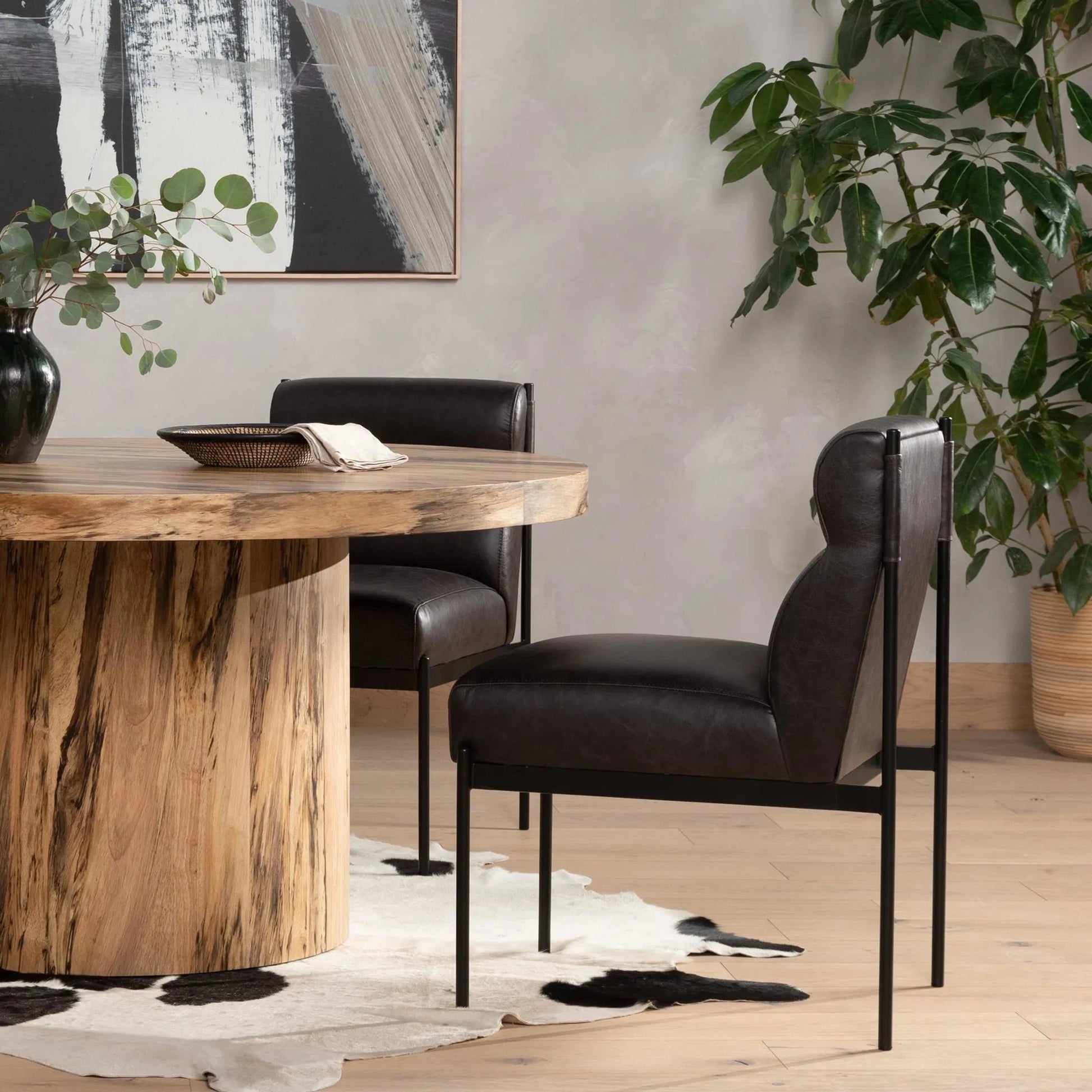 Klein Dining Chair by Four Hands in sonoma black. Made from top grain leather, iron, 100% polyester in a modern style.