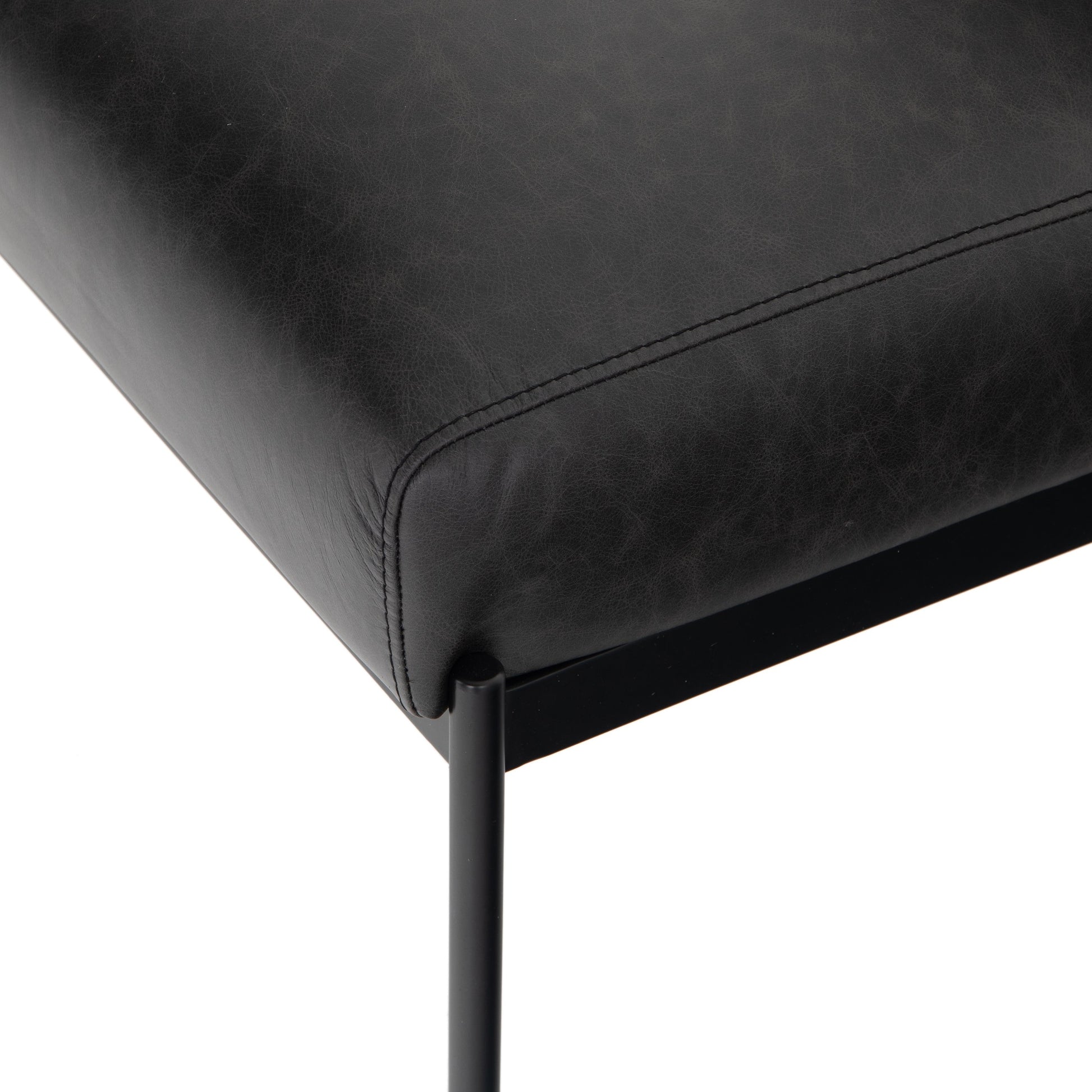 Klein Dining Chair by Four Hands in sonoma black. Made from top grain leather, iron, 100% polyester in a modern style.