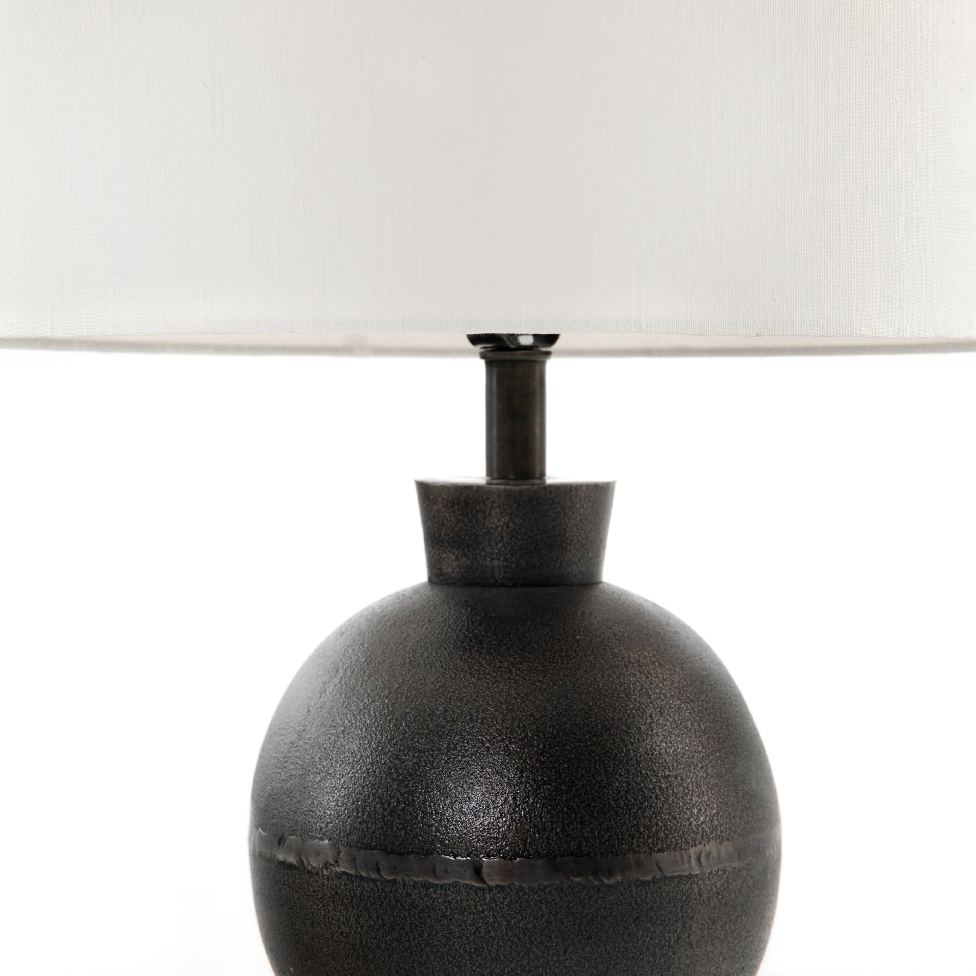 Kelita Table Lamp by Four Hands in textured black. Made from aluminum, 60% polyester, 40% viscose (rayon), thermoplastic in a transitional style.