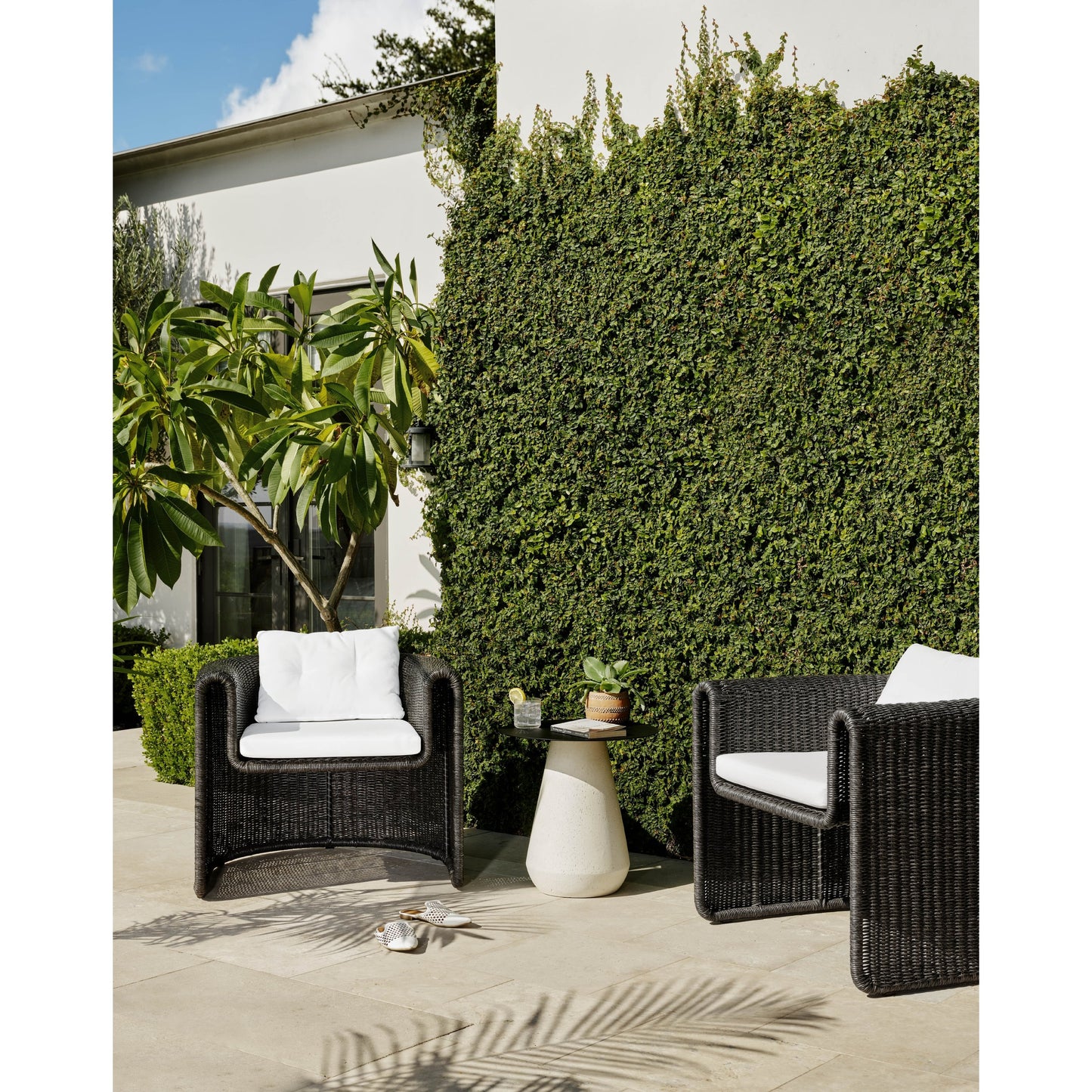003 SI-1717070 | Lifestyle | Tucson Woven Outdoor Chair by Four Hands. Made from 100% olefin, 100% polyethylene, iron in a coastal style.