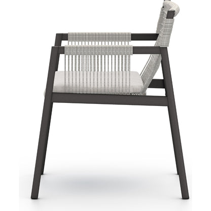Shuman Outdoor Dining Chair by Four Hands. Made from 100% olefin, aluminum, 100% polypropylene in a modern style.