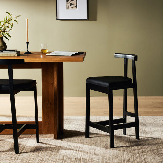 Tex Counter Stool by Four Hands in black leather. Made from top grain leather, solid rosa morada, 100% polyurethane foam in a modern style.
