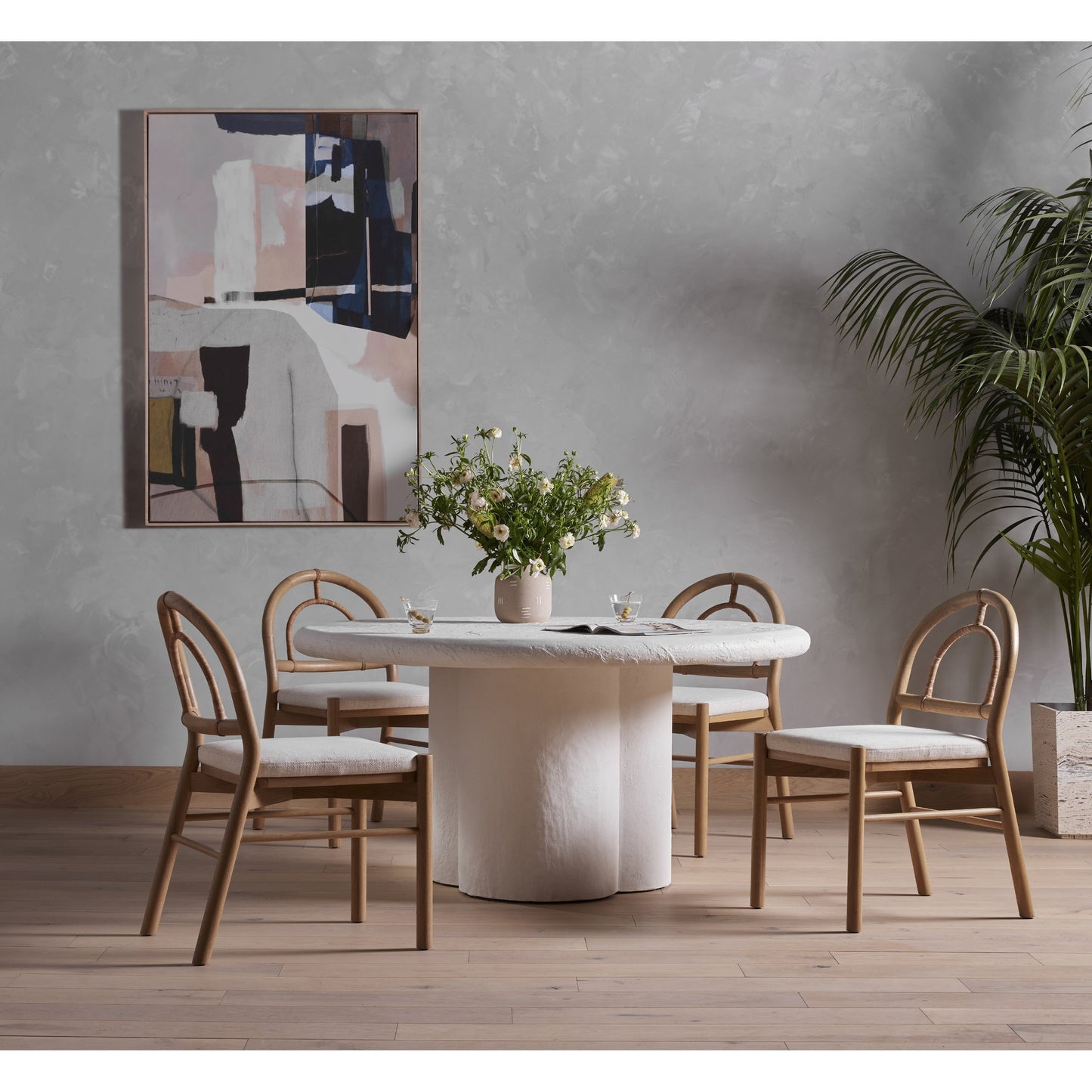 001 SI-1715450 | Lifestyle | Grano Dining Table by Four Hands in white plaster molded concrete. Made from concrete in a modern style.