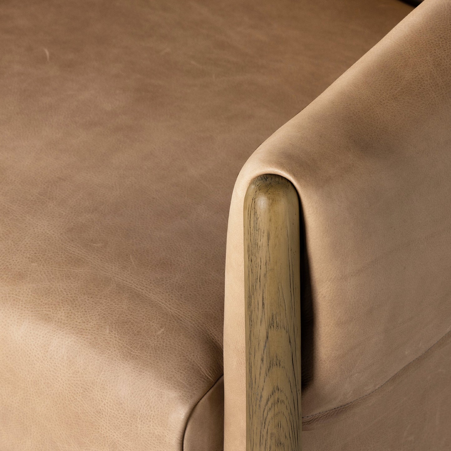 026 SI-1901114 | Closeup | Idris Chair by Four Hands in palermo nude and tawny oak. Made from top grain leather, solid oak, poplar plywood in a modern style.