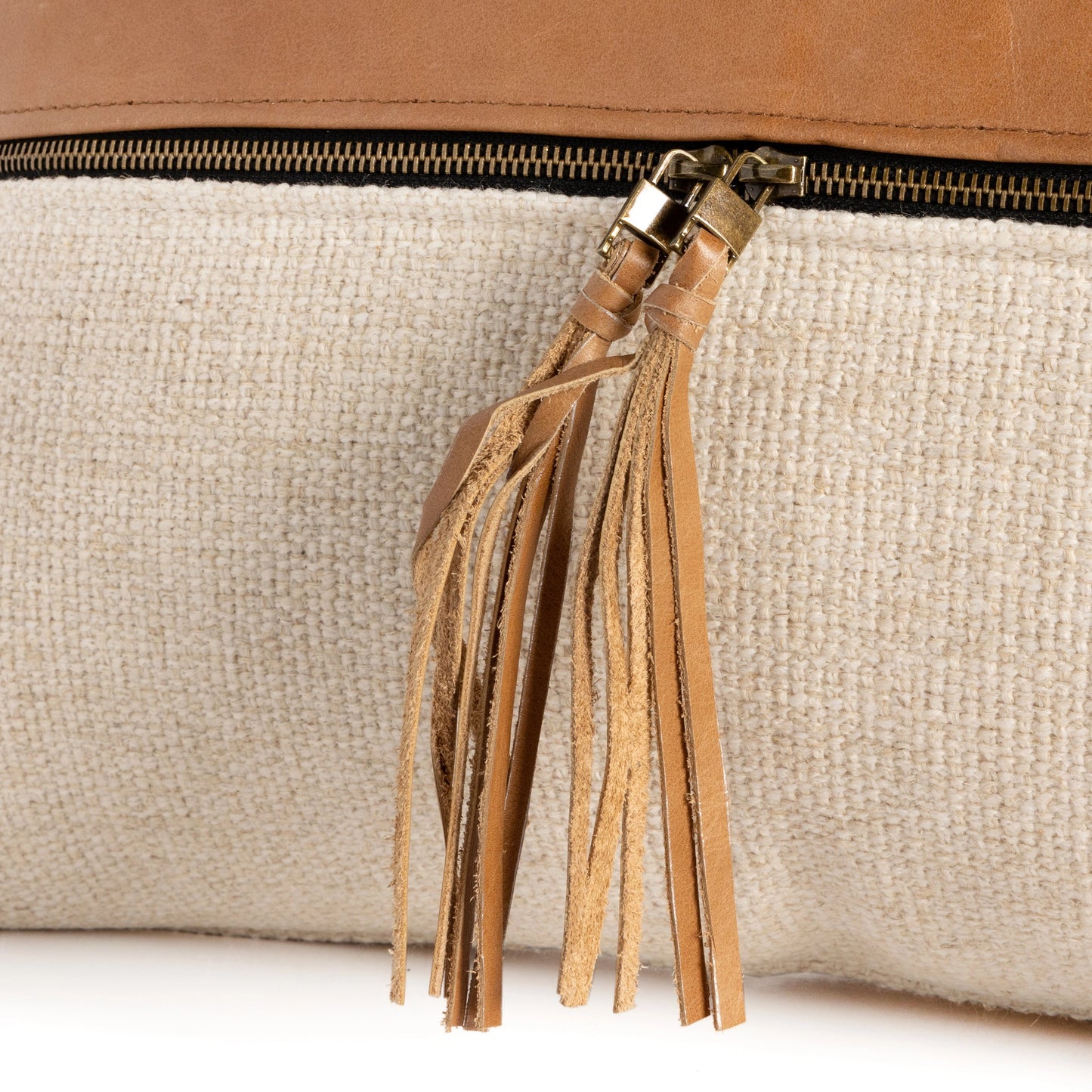 007 SI-1797919 | Closeup | Leather and Linen Pillow by Four Hands in thames cream, sonoma butterscotch and butterscotch. Made from top grain leather, 66% polyester, 19% acrylic, 15% flax, linen in a eclectic & global style.
