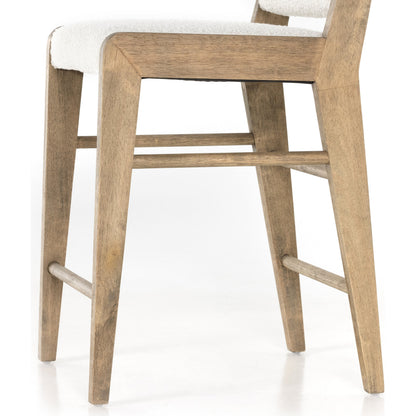 Charon Counter Stool by Four Hands in knoll natural and weathered drift. Made from 95% polyester, 5% acrylic, solid parawood, 100% polyester in a transitional style.