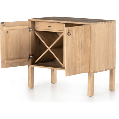 Isador Bar Cabinet by Four Hands in black wash poplar, natural iron, black leather and black wash poplar. Made from solid poplar, top grain leather in a modern style.