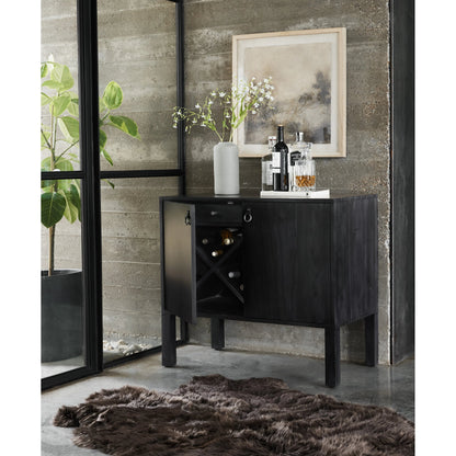 Isador Bar Cabinet by Four Hands in black wash poplar, natural iron, black leather and black wash poplar. Made from solid poplar, top grain leather in a modern style.