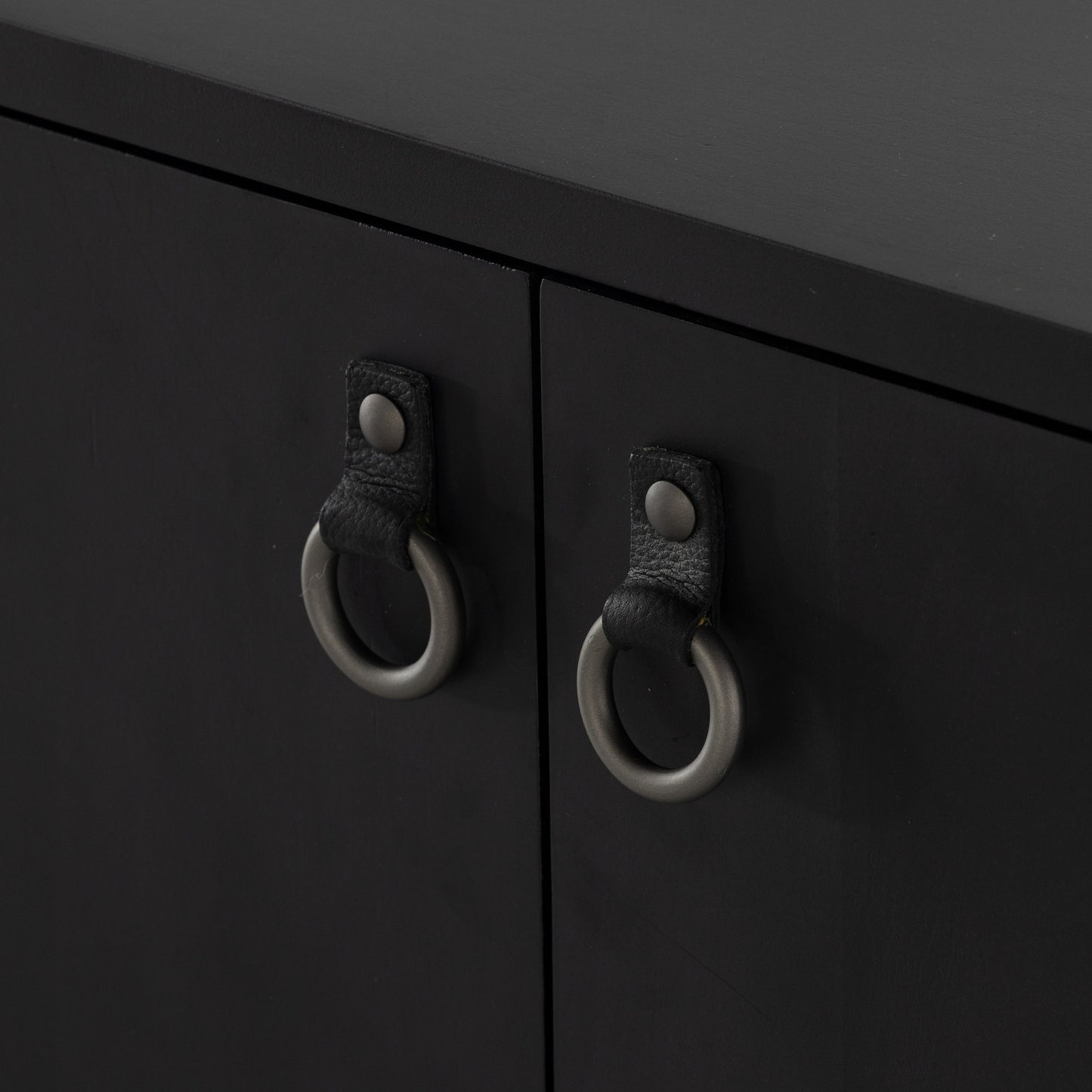 010 SI-1902046 | Additional Silo | Isador Bar Cabinet by Four Hands in black wash poplar, natural iron, black leather and black wash poplar. Made from solid poplar, top grain leather in a modern style.