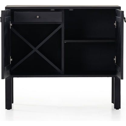 Isador Bar Cabinet by Four Hands in black wash poplar, natural iron, black leather and black wash poplar. Made from solid poplar, top grain leather in a modern style.