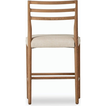 Glenmore Counter Stool by Four Hands in essence natural. Made from 49% viscose (rayon), 22% flax, linen, 18% polyester, 11% cotton, solid oak, 100% polyurethane foam pad in a modern style.