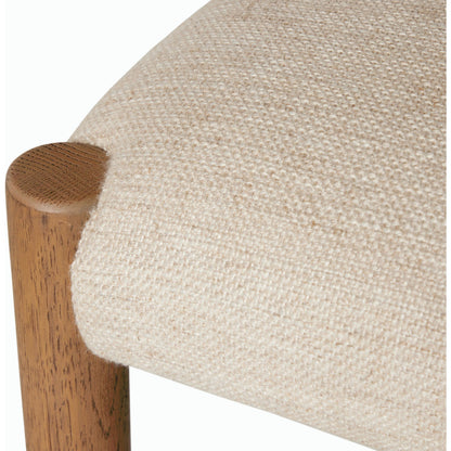 Glenmore Counter Stool by Four Hands in essence natural. Made from 49% viscose (rayon), 22% flax, linen, 18% polyester, 11% cotton, solid oak, 100% polyurethane foam pad in a modern style.
