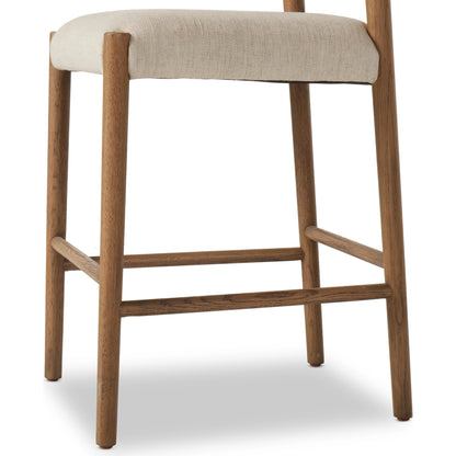 Glenmore Counter Stool by Four Hands in essence natural. Made from 49% viscose (rayon), 22% flax, linen, 18% polyester, 11% cotton, solid oak, 100% polyurethane foam pad in a modern style.