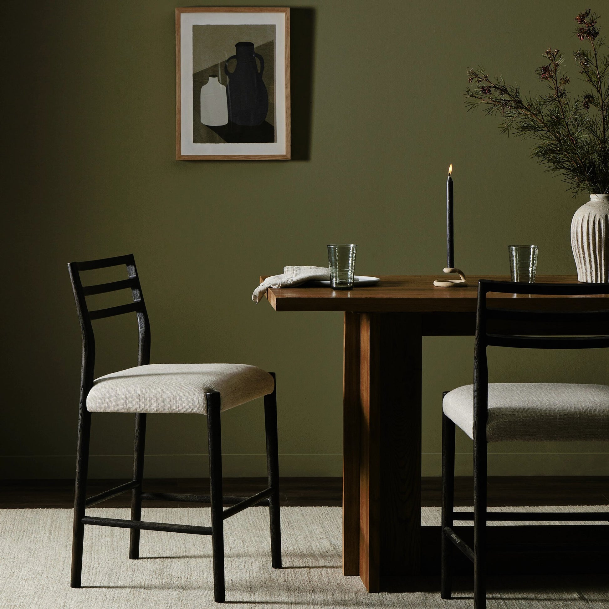 Glenmore Counter Stool by Four Hands in essence natural. Made from 49% viscose (rayon), 22% flax, linen, 18% polyester, 11% cotton, solid oak, 100% polyurethane foam pad in a modern style.