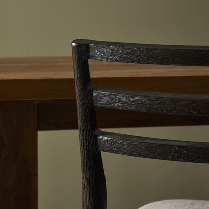 Glenmore Counter Stool by Four Hands in essence natural. Made from 49% viscose (rayon), 22% flax, linen, 18% polyester, 11% cotton, solid oak, 100% polyurethane foam pad in a modern style.