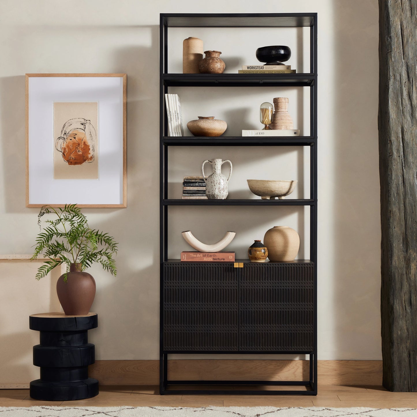 013 SI-1977436 | Lifestyle | Kelby Bookcase by Four Hands in carved vintage brown. Made from iron, solid mango in a modern style.