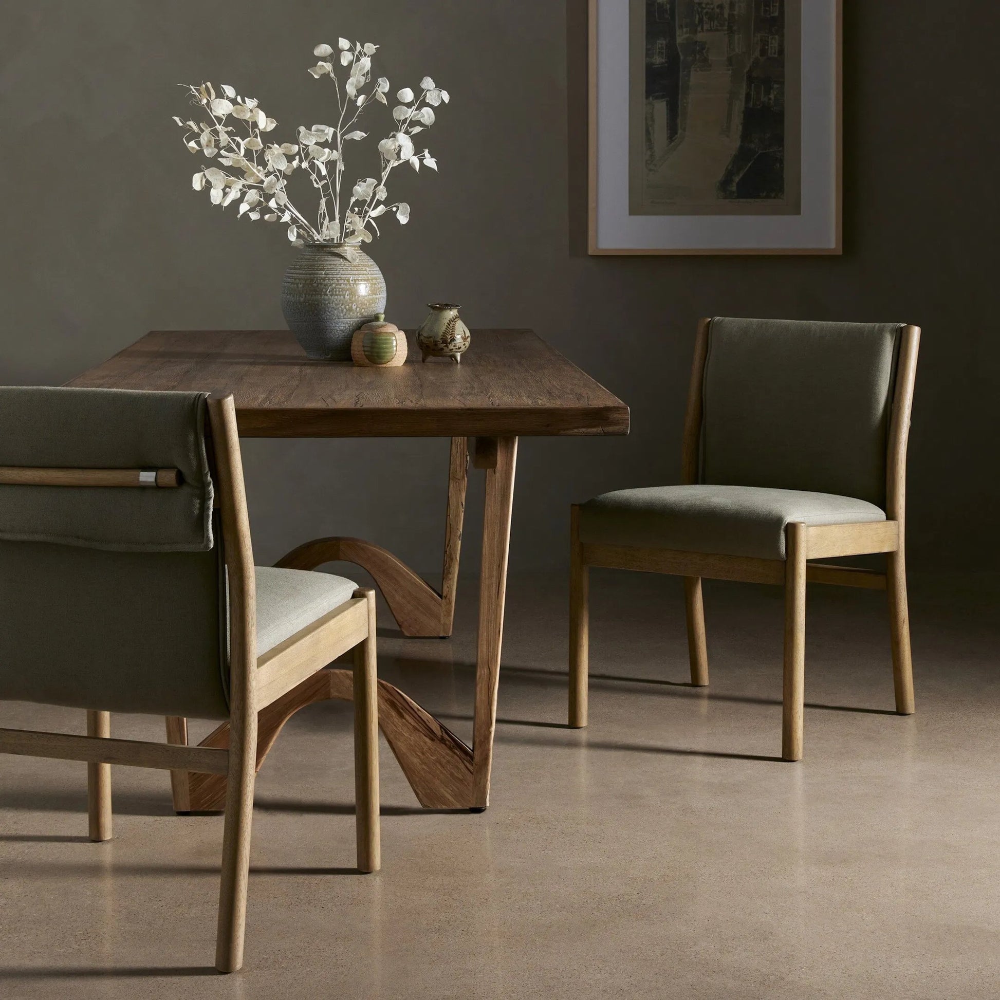 Hito Dining Chair by Four Hands in villa olive and burnished parawood. Made from 62% cotton, 20% flax, linen, 18% viscose (rayon), solid parawood, stainless steel in a transitional style.