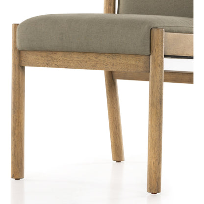 Hito Dining Chair by Four Hands in villa olive and burnished parawood. Made from 62% cotton, 20% flax, linen, 18% viscose (rayon), solid parawood, stainless steel in a transitional style.