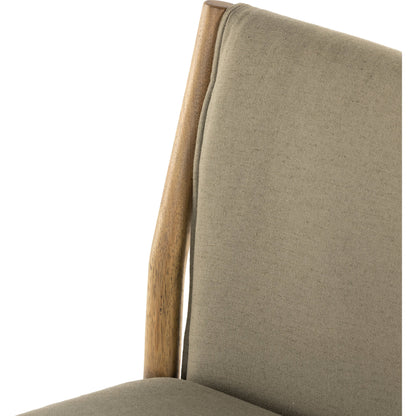 Hito Dining Chair by Four Hands in villa olive and burnished parawood. Made from 62% cotton, 20% flax, linen, 18% viscose (rayon), solid parawood, stainless steel in a transitional style.