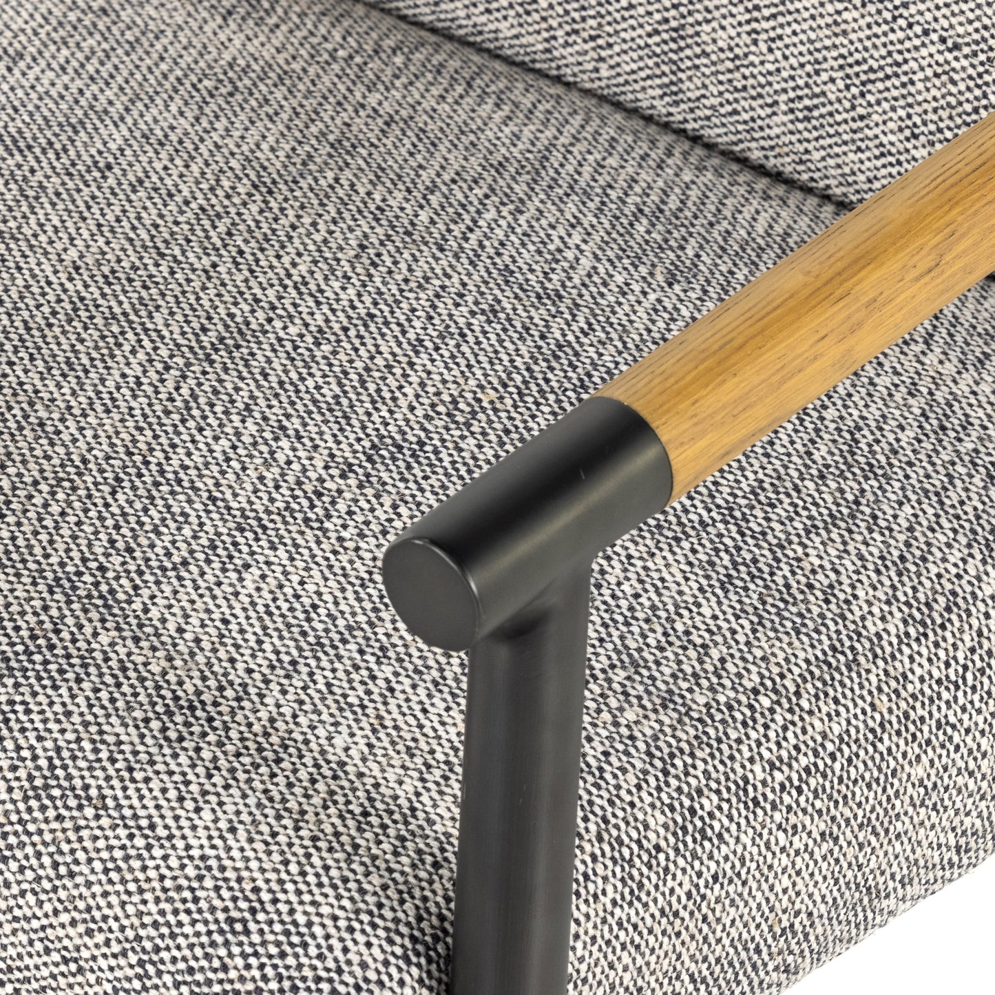 027 SI-1798694 | Closeup | Rowen Dining Chair by Four Hands in thames raven, toasted oak, carbon black. Made from 66% polyester, 19% acrylic, 15% flax, linen, stainless steel, solid oak in a modern style.