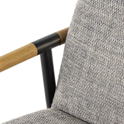 Rowen Dining Chair by Four Hands in thames raven, toasted oak, carbon black. Made from 66% polyester, 19% acrylic, 15% flax, linen, stainless steel, solid oak in a modern style.