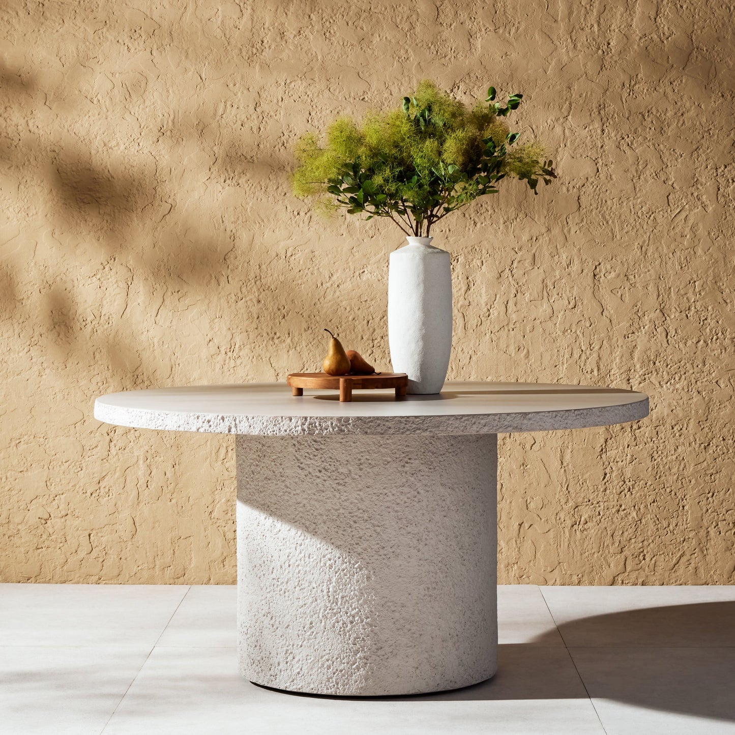 008 SI-1902161 | Lifestyle | Otero Round Outdoor Dining Table by Four Hands in blanc white, matte white. Made from concrete in a transitional style.