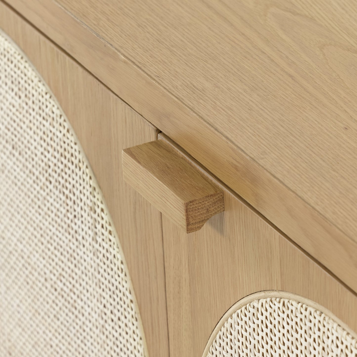 010 SI-1798891 | Closeup | Allegra Sideboard by Four Hands in honey oak, honey oak veneer, light natural cane and honey oak. Made from solid oak, oak veneer in a modern style.