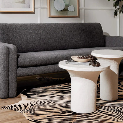 Parra Low End Table by Four Hands in plaster molded concrete, white concrete and white. Made from concrete in a modern style.