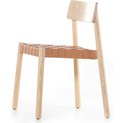 Heisler Dining Chair by Four Hands in almond leather and black. Made from solid ash, 70% split leather, 30% polyvinyl chloride (pvc), ash veneer in a modern style.