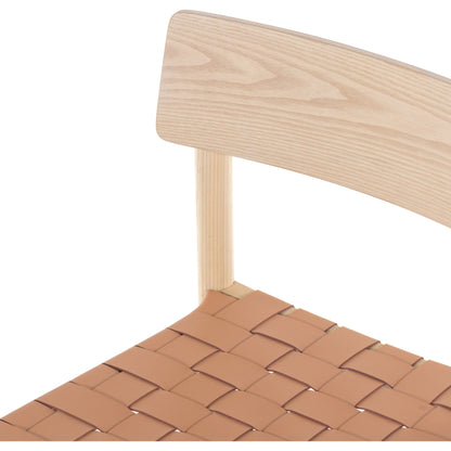 Heisler Dining Chair by Four Hands in almond leather and black. Made from solid ash, 70% split leather, 30% polyvinyl chloride (pvc), ash veneer in a modern style.