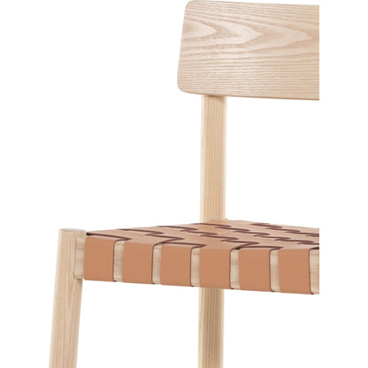 Heisler Dining Chair by Four Hands in almond leather and black. Made from solid ash, 70% split leather, 30% polyvinyl chloride (pvc), ash veneer in a modern style.