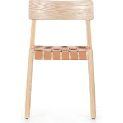 Heisler Dining Chair by Four Hands in almond leather and black. Made from solid ash, 70% split leather, 30% polyvinyl chloride (pvc), ash veneer in a modern style.