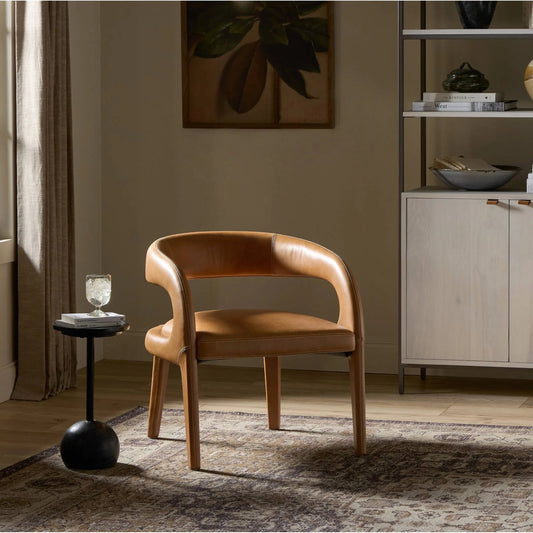 Hawkins Chair by Four Hands in sonoma butterscotch. Made from top grain leather, poplar plywood, 100% polyester in a modern style.