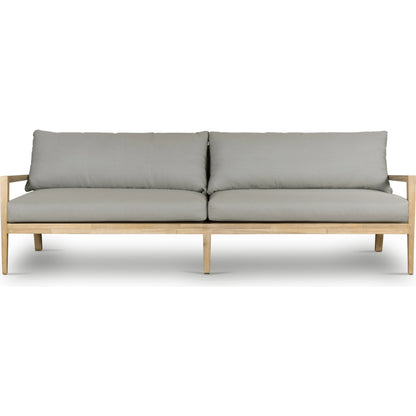 Amaya Outdoor Sofa by Four Hands in royal taupe and natural acacia. Made from solid fsc®-certified acacia, 100% polyester in a modern style.