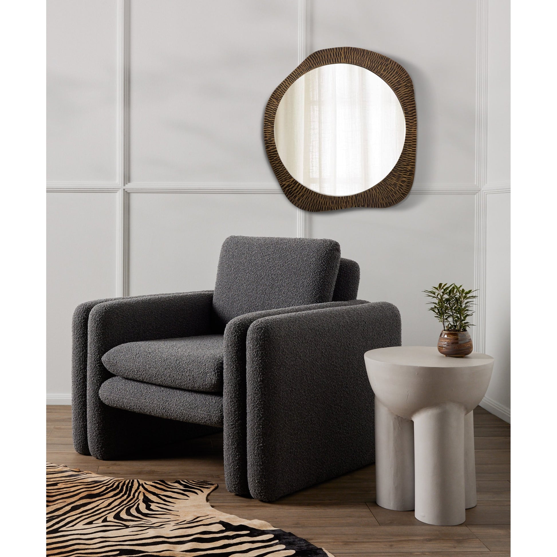 Sante End Table by Four Hands in raw black. Made from aluminum, engineered hardwood in a modern style.