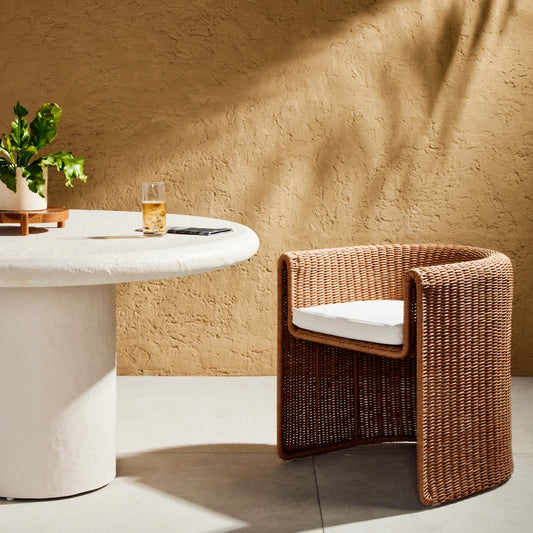 Tuscon Outdoor Dining Chair by Four Hands. Made from 100% olefin, 100% polyethylene, 90% polyurethane foam pad, 10% polyester fiber batting in a modern style.