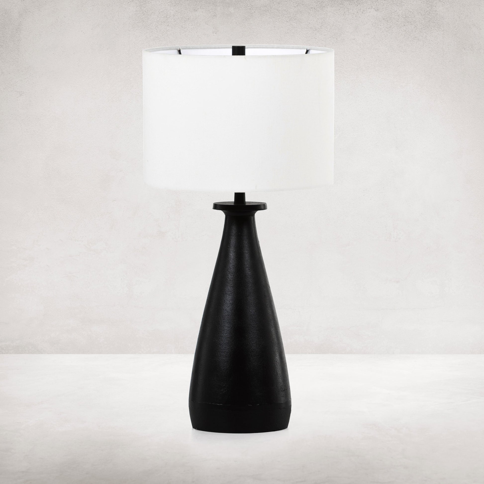 Innes Table Lamp by Four Hands in matte black. Made from aluminum, 60% polyester, 40% viscose (rayon) in a modern style.