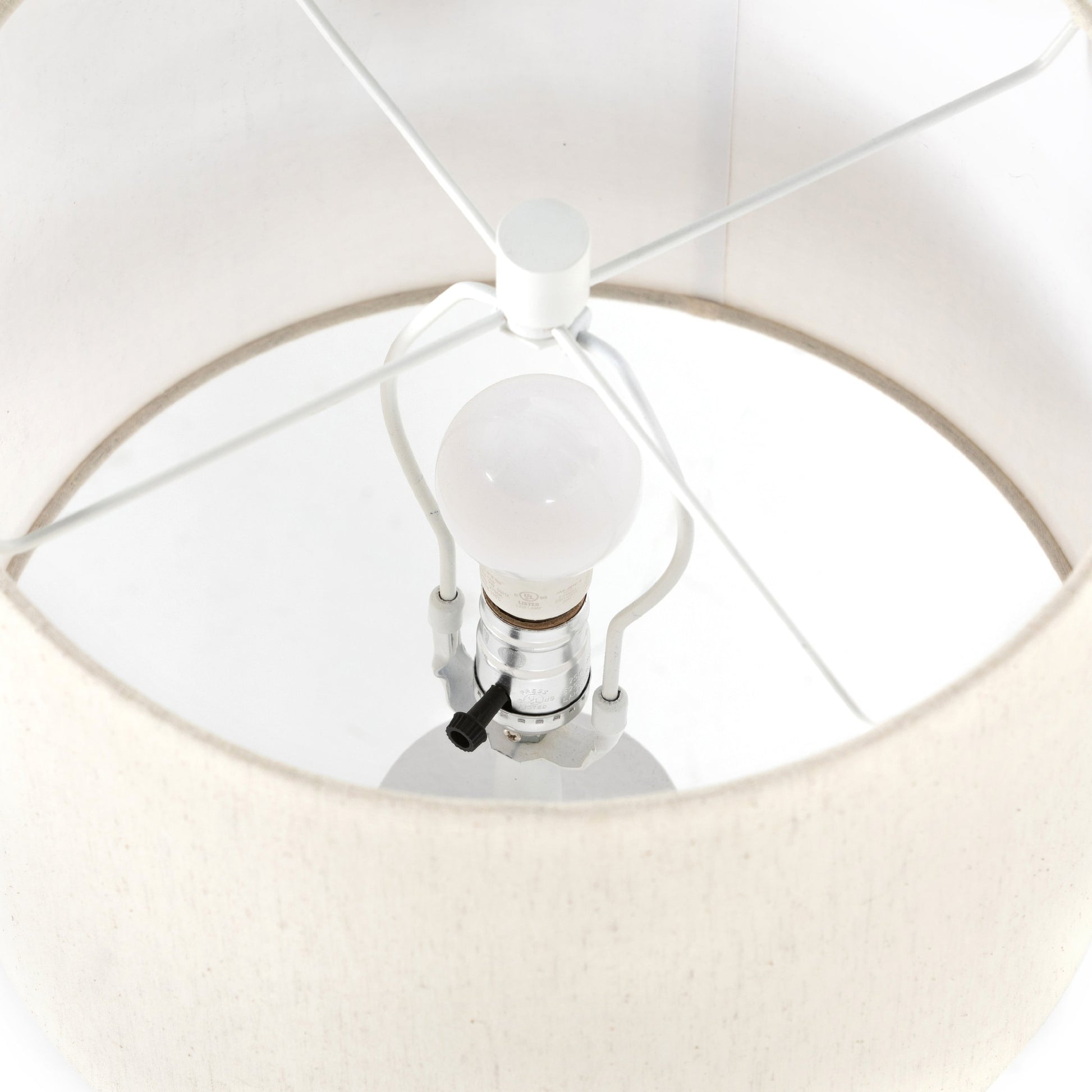 Innes Table Lamp by Four Hands in matte black. Made from aluminum, 60% polyester, 40% viscose (rayon) in a modern style.