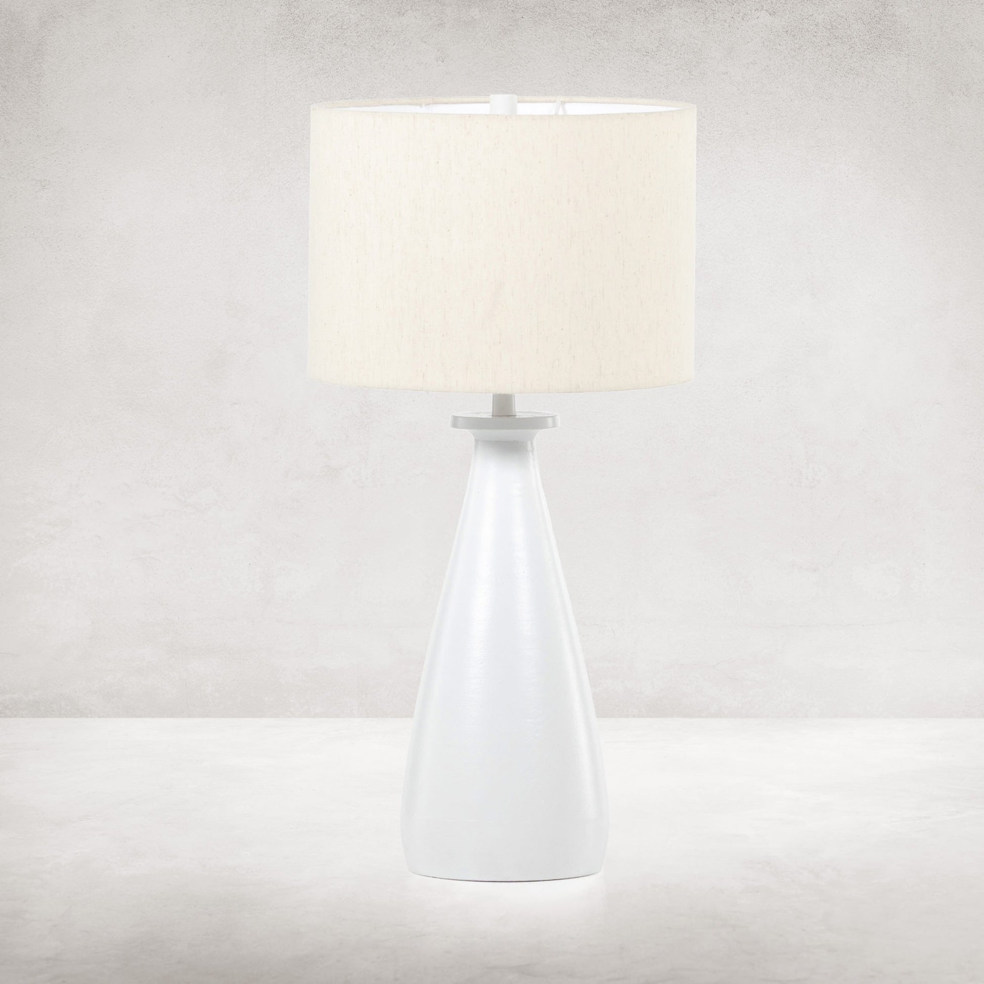 Innes Table Lamp by Four Hands in matte black. Made from aluminum, 60% polyester, 40% viscose (rayon) in a modern style.