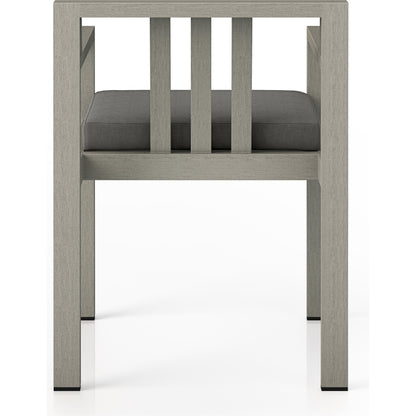 Monterey Outdoor Dining Armchair, Weathered Grey by Four Hands in weathered grey. Made from 100% olefin, solid fsc®-certified teak, 91% polyurethane foam pad, 9% polyester fiber batting in a modern style.