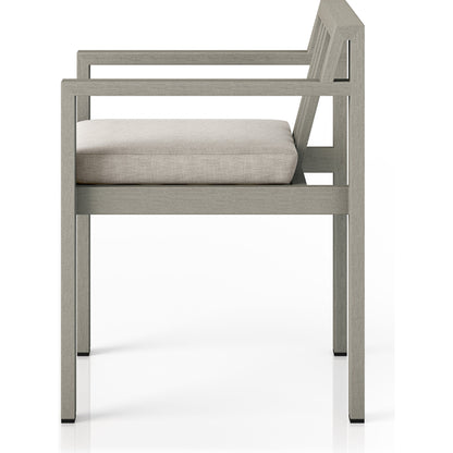 Monterey Outdoor Dining Armchair, Weathered Grey by Four Hands in weathered grey. Made from 100% olefin, solid fsc®-certified teak, 91% polyurethane foam pad, 9% polyester fiber batting in a modern style.