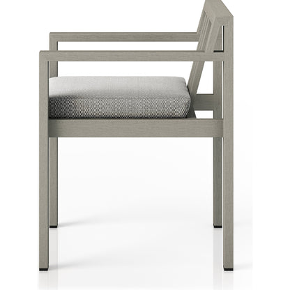 Monterey Outdoor Dining Armchair, Weathered Grey by Four Hands in weathered grey. Made from 100% olefin, solid fsc®-certified teak, 91% polyurethane foam pad, 9% polyester fiber batting in a modern style.