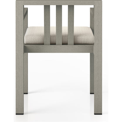 Monterey Outdoor Dining Armchair, Weathered Grey by Four Hands in weathered grey. Made from 100% olefin, solid fsc®-certified teak, 91% polyurethane foam pad, 9% polyester fiber batting in a modern style.
