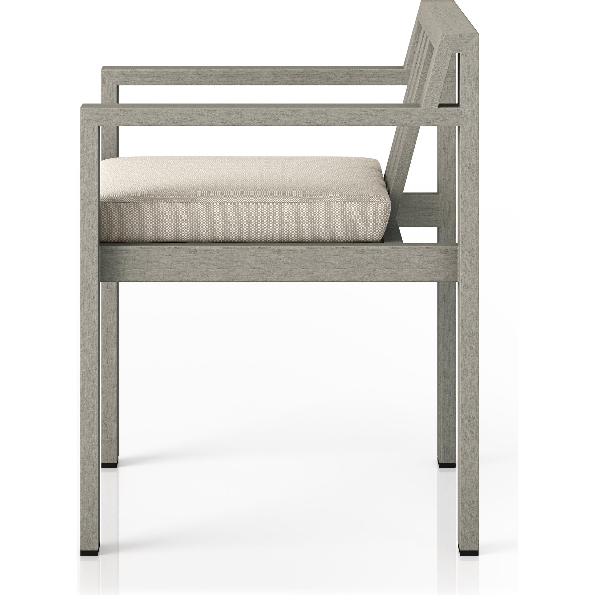 Monterey Outdoor Dining Armchair, Weathered Grey by Four Hands in weathered grey. Made from 100% olefin, solid fsc®-certified teak, 91% polyurethane foam pad, 9% polyester fiber batting in a modern style.