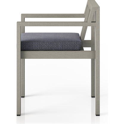 Monterey Outdoor Dining Armchair, Weathered Grey by Four Hands in weathered grey. Made from 100% olefin, solid fsc®-certified teak, 91% polyurethane foam pad, 9% polyester fiber batting in a modern style.
