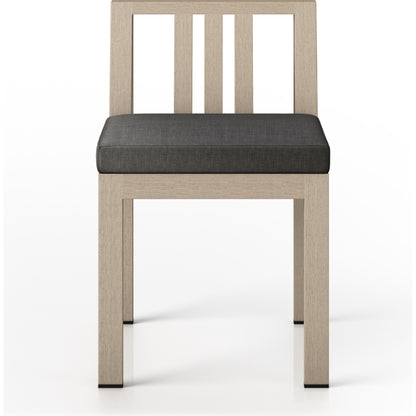Monterey Outdoor Dining Chair by Four Hands in washed brown. Made from 100% olefin, solid fsc®-certified teak, 91% polyurethane foam pad, 9% polyester fiber batting in a modern style.