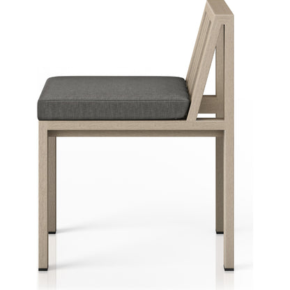 Monterey Outdoor Dining Chair by Four Hands in washed brown. Made from 100% olefin, solid fsc®-certified teak, 91% polyurethane foam pad, 9% polyester fiber batting in a modern style.