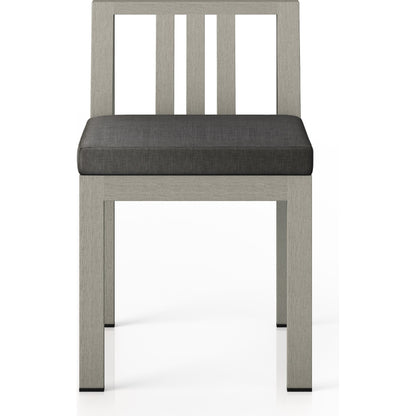 Monterey Outdoor Dining Chair by Four Hands in washed brown. Made from 100% olefin, solid fsc®-certified teak, 91% polyurethane foam pad, 9% polyester fiber batting in a modern style.