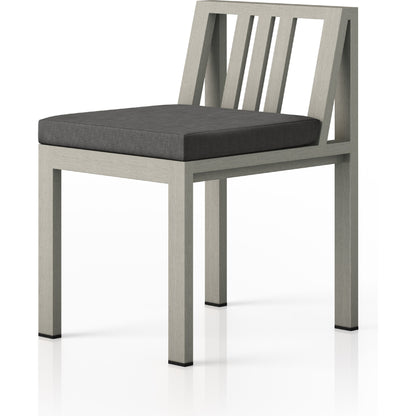Monterey Outdoor Dining Chair by Four Hands in washed brown. Made from 100% olefin, solid fsc®-certified teak, 91% polyurethane foam pad, 9% polyester fiber batting in a modern style.